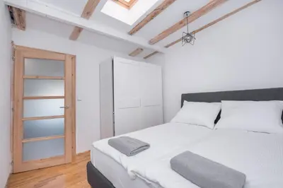 Łóżko lub łóżka w pokoju w obiekcie Apartament Nowy Świat 1