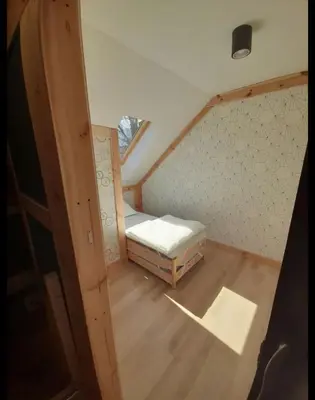 Łóżko lub łóżka w pokoju w obiekcie Noclegi w Kudowie