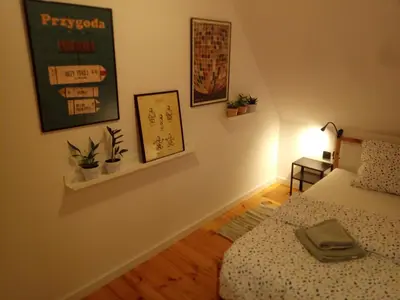Łóżko lub łóżka w pokoju w obiekcie na Maków