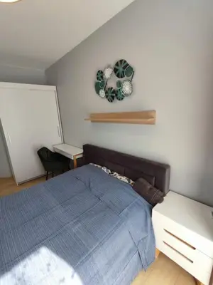 Łóżko lub łóżka w pokoju w obiekcie Green Apartment
