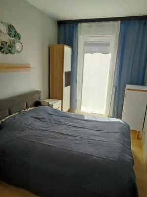 Łóżko lub łóżka w pokoju w obiekcie Green Apartment