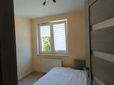 Łóżko lub łóżka w pokoju w obiekcie Apartament Rodzinny Silver 3 Sypialnie