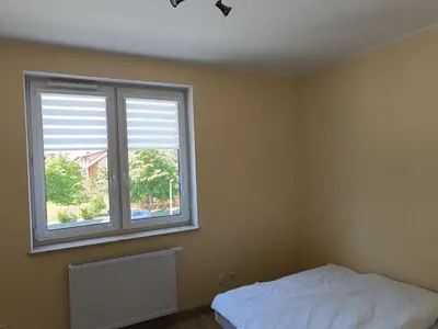 Łóżko lub łóżka w pokoju w obiekcie Apartament Rodzinny Silver 3 Sypialnie
