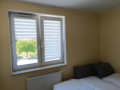 Łóżko lub łóżka w pokoju w obiekcie Apartament Rodzinny Silver 3 Sypialnie