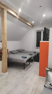 Łóżko lub łóżka w pokoju w obiekcie Porębana Osada