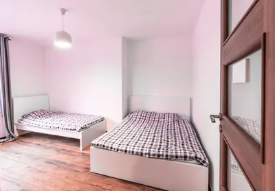 Łóżko lub łóżka w pokoju w obiekcie Paprotkowy Zakątek