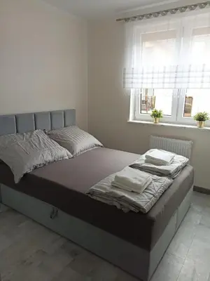 Łóżko lub łóżka w pokoju w obiekcie Apartament Brzeg