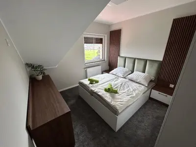 Łóżko lub łóżka w pokoju w obiekcie Restauracja & Bar u Dudy