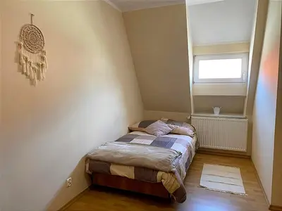 Łóżko lub łóżka w pokoju w obiekcie Pokoje W Pięknej Kamienicy W Centrum W Głogówku