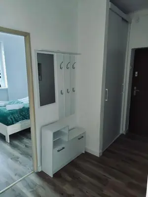 Łóżko lub łóżka w pokoju w obiekcie Apartament z parkingiem