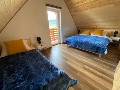 Łóżko lub łóżka w pokoju w obiekcie Zielony Zakątek Lasówka