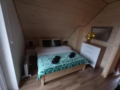 Łóżko lub łóżka w pokoju w obiekcie Zielony Zakątek Lasówka