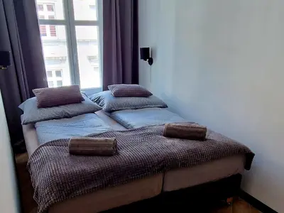 Łóżko lub łóżka w pokoju w obiekcie Apartament Książ