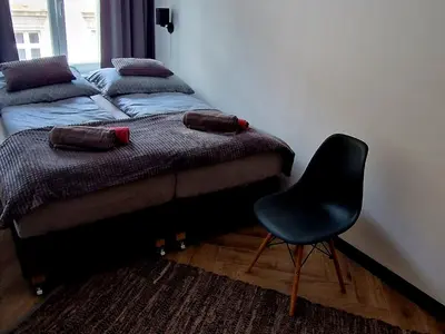 Łóżko lub łóżka w pokoju w obiekcie Apartament Książ