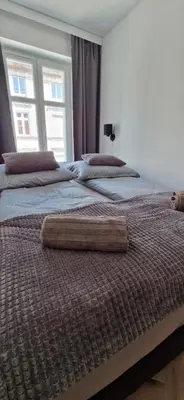 Łóżko lub łóżka w pokoju w obiekcie Apartament Książ