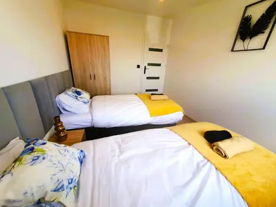 Łóżko lub łóżka w pokoju w obiekcie HappyStay Gold
