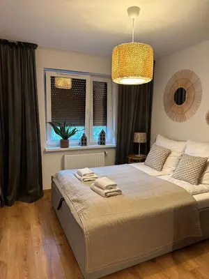 Łóżko lub łóżka w pokoju w obiekcie Apartament 25 Rowery, Spacery w Dolinie Baryczy - 5D Apartamenty