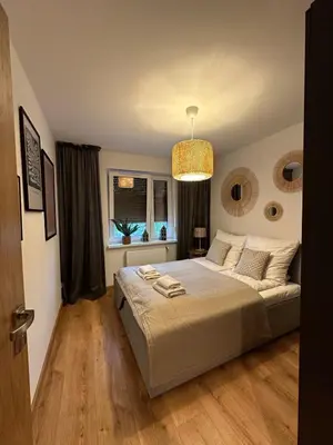 Łóżko lub łóżka w pokoju w obiekcie Apartament 25 Rowery, Spacery w Dolinie Baryczy - 5D Apartamenty