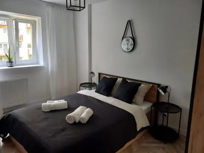 Łóżko lub łóżka w pokoju w obiekcie katedrahouse