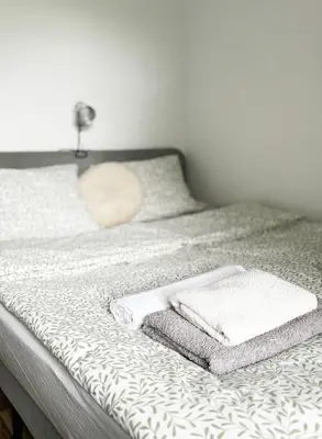 Łóżko lub łóżka w pokoju w obiekcie Na początku