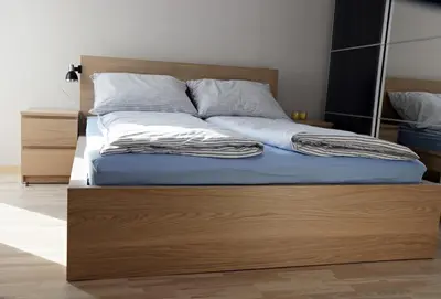 Łóżko lub łóżka w pokoju w obiekcie Apartament Amerigo