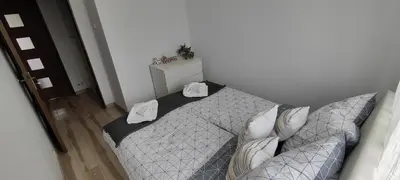 Łóżko lub łóżka w pokoju w obiekcie CITY VIEW Zamenhofa II