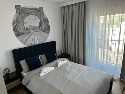 Łóżko lub łóżka w pokoju w obiekcie Apartamenty Wroclawia Centrum