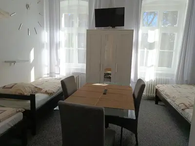Łóżko lub łóżka w pokoju w obiekcie Hotel Polonia