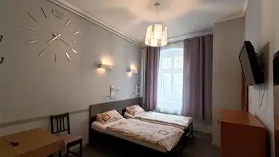 Łóżko lub łóżka w pokoju w obiekcie Hotel Polonia