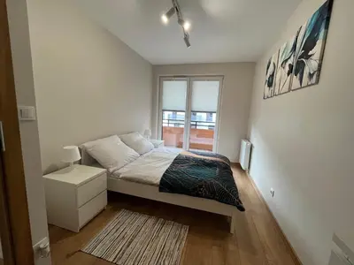 Łóżko lub łóżka w pokoju w obiekcie Apartament 45