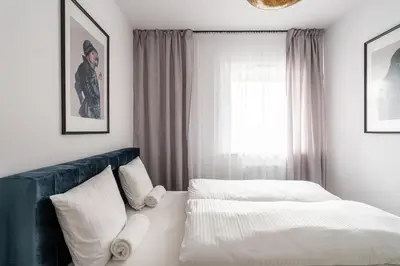 Łóżko lub łóżka w pokoju w obiekcie RentPlanet - Nowa Manufaktura