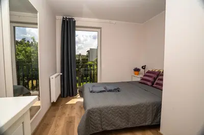 Łóżko lub łóżka w pokoju w obiekcie Domek w Antoninie