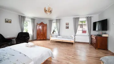 Łóżko lub łóżka w pokoju w obiekcie Dom Pod Dębem Agroturystyka