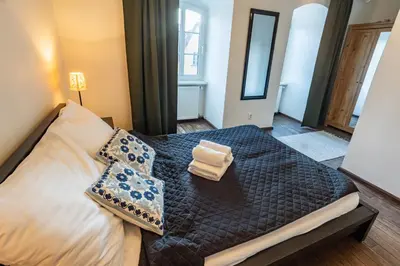 Łóżko lub łóżka w pokoju w obiekcie Zakątek Krasnala - Mieszkanie w Rynku