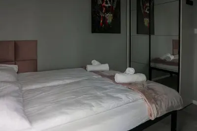 Łóżko lub łóżka w pokoju w obiekcie Jej i Jego - Eleganckie domki z balią na wyłączność