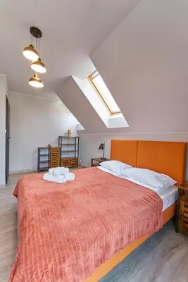 Łóżko lub łóżka w pokoju w obiekcie LAGUNA LOFT Aleja Zwycięzców Dwupoziomowy