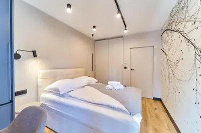 Łóżko lub łóżka w pokoju w obiekcie LAGUNA Ogrody Pieniawskie 18 SAPPHIRE VIP z tarasem