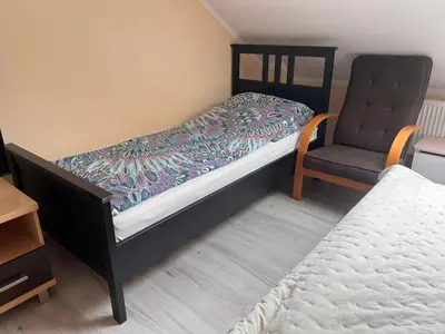 Łóżko lub łóżka w pokoju w obiekcie Apartament Pod Orzechem