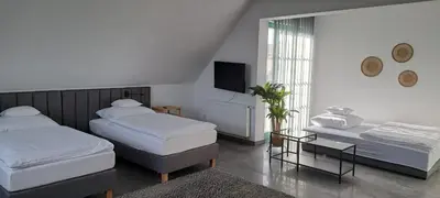 Łóżko lub łóżka w pokoju w obiekcie Tulipan