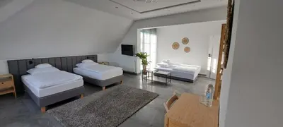Łóżko lub łóżka w pokoju w obiekcie Tulipan