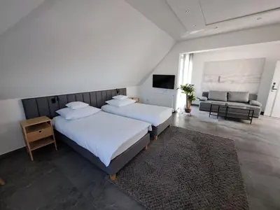 Łóżko lub łóżka w pokoju w obiekcie Tulipan