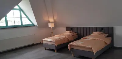 Łóżko lub łóżka w pokoju w obiekcie Tulipan