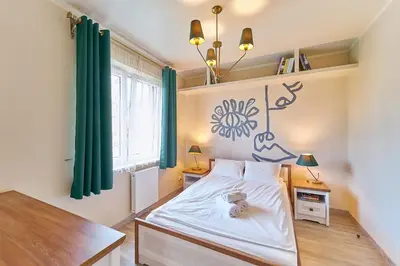 Łóżko lub łóżka w pokoju w obiekcie LAGUNA Willa Leśna 25 RETRO przy Parku Zdrojowym