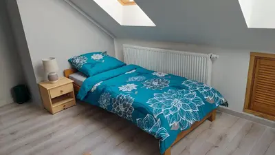 Łóżko lub łóżka w pokoju w obiekcie Agroturystyka Zielona Dolina