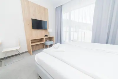 Łóżko lub łóżka w pokoju w obiekcie VacationClub - Aparthotel Czarna Góra 218