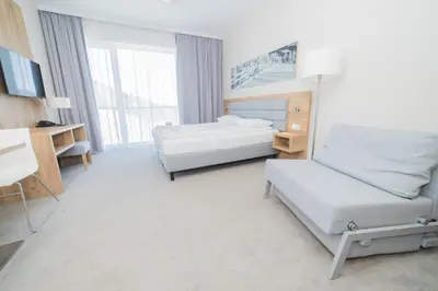 Łóżko lub łóżka w pokoju w obiekcie VacationClub - Aparthotel Czarna Góra 218