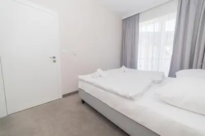 Łóżko lub łóżka w pokoju w obiekcie VacationClub - Aparthotel Czarna Góra 221