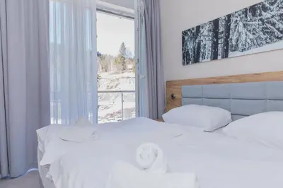 Łóżko lub łóżka w pokoju w obiekcie VacationClub - Aparthotel Czarna Góra 221