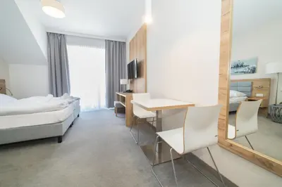 Łóżko lub łóżka w pokoju w obiekcie VacationClub - Aparthotel Czarna Góra 309