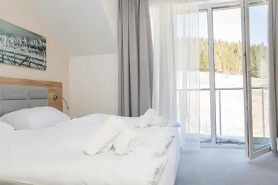 Łóżko lub łóżka w pokoju w obiekcie VacationClub - Aparthotel Czarna Góra 309